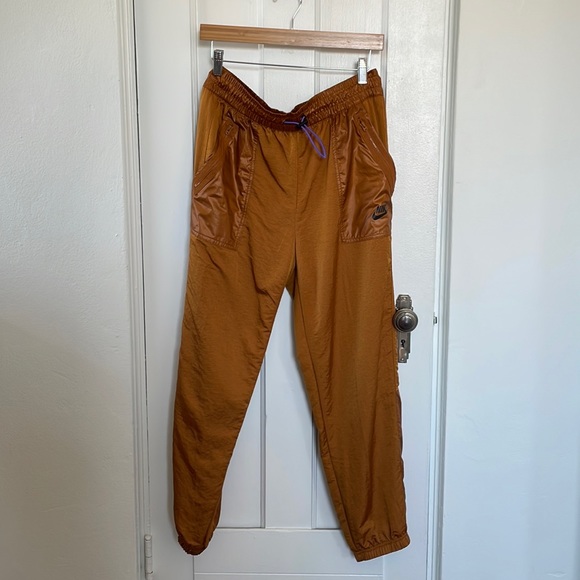 Nike gold nylon joggers with purple bungee cord - Picture 3 of 4